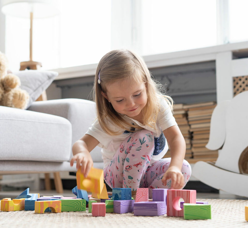 little girl playing with blocks